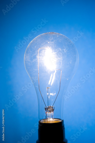 Close up of a lit tungsten Lightbulb photo