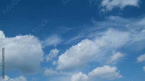 Angel wing shaped cloud cirrus and cumulus on different layers clouds against blue heaven. Cirrus clouds in blue sky. Panoramic skyscape. Timelapse. photo