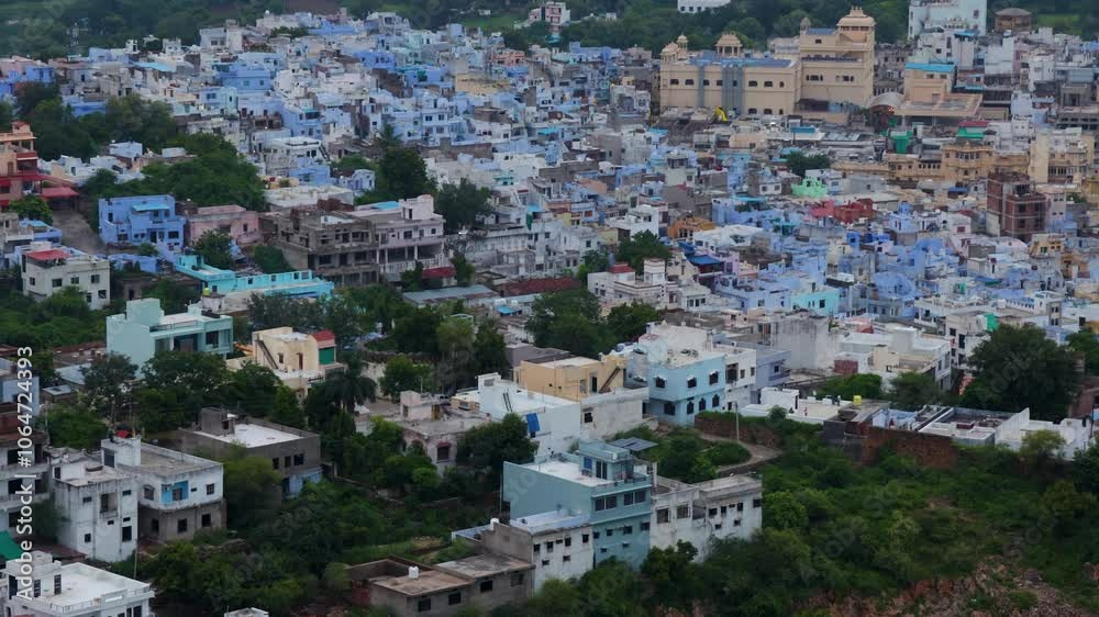 Aerial View of Crowded Blue City Houses at Mountain Base in the Evening Aerial View of Crowded Blue City Houses at Mountain Base in the Evening