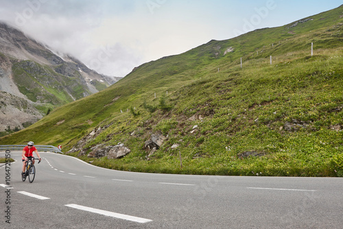 Obraz na płótnie Cyclist in alpine serpentine mountain road. Highlight route in Austria w salonie