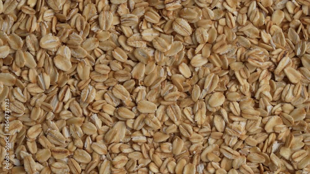 Macro video of rolled oats kept on rotating disk. Macro video of rolled oats kept on rotating disk.