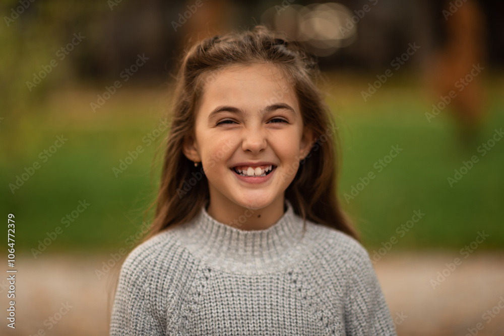Portrait of a happy child girl looking at camera and smiling. Portrait of a happy child girl looking at camera and smiling.
