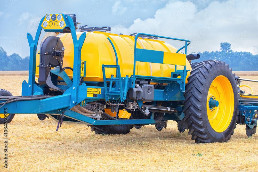 Modern agricultural machinery in field, yellow tractor with large wheels, advanced technology, farming vehicle concept