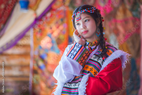 Portrait Fashion of the Asian Tourist young girl wearing traditional Tibetan clothing costume during the Nepal.  Tibetan woman dress concept. Tibetans an East Asian ethnic group native.