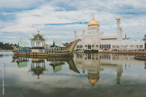 Majestic Sultan Omar Ali Saifuddien Mosque and Royal Barge in Brunei on a cloudy day photo