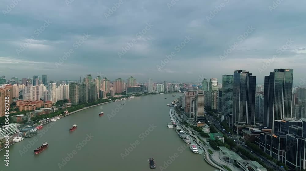 Aerial drone view of Shanghai city center in China,Asia. Huangpu River in Shanghai frome drone. Huangpu River, Huangxiepu or Chunshen River the landmark of Shanghai, Pudong and Puxi. Aerial drone view of Shanghai city center in China,Asia. Huangpu River in Shanghai frome drone. Huangpu River, Huangxiepu or Chunshen River the landmark of Shanghai, Pudong and Puxi.