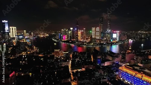 Wallpaper Mural Aerial drone night view of  Shanghai city center in China,Asia. Huangpu River in night Shanghai frome drone. Huangpu River, Huangxiepu or Chunshen River the  landmark of Shanghai, Pudong and Puxi. Torontodigital.ca