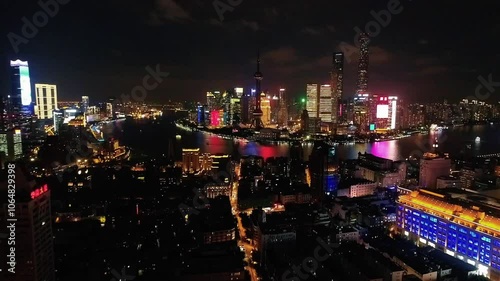 Wallpaper Mural Aerial drone night view of  Shanghai city center in China,Asia. Huangpu River in night Shanghai frome drone. Huangpu River, Huangxiepu or Chunshen River the  landmark of Shanghai, Pudong and Puxi. Torontodigital.ca