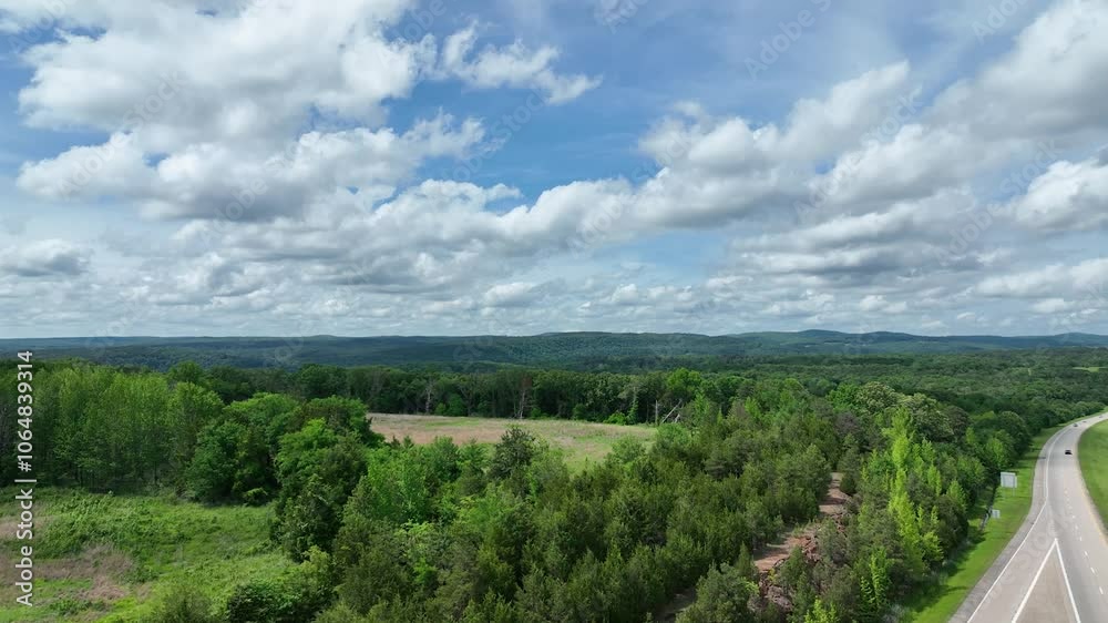 Drone view of beautiful Arkansas forest with rolling hills in the distance Drone view of beautiful Arkansas forest with rolling hills in the distance