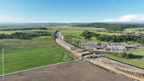 Highway in construction drone aerial Czech Prerov, destruction of agricultural land fields village, remove of people houses and buildings land grabbing extension works additional lanes way new road photo