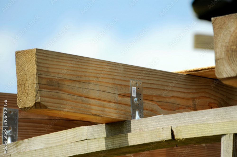 Wooden beams as part of an ecological wooden frame house construction Wooden beams as part of an ecological wooden frame house construction