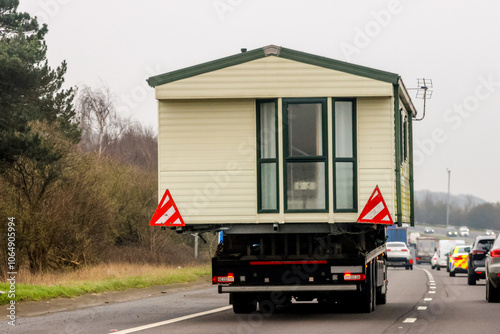 A Lorry Carrying A Static Caravan Home To It's Next Location And New Customer