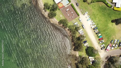 Murrays beach sandy waterfront beach aerial top down summer lifestyle view 4k.
 photo