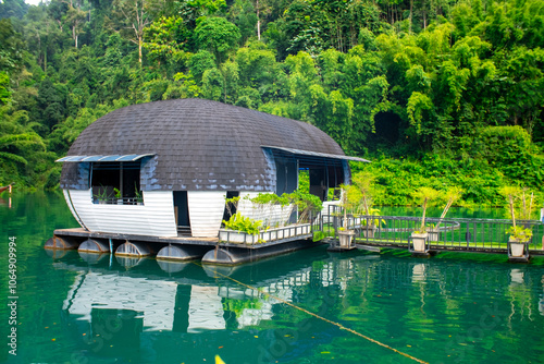 Capsule houses on the water in Thailand on Lake Cheo Lan. Water bungalows for relaxation in Khao Sok National Park. photo