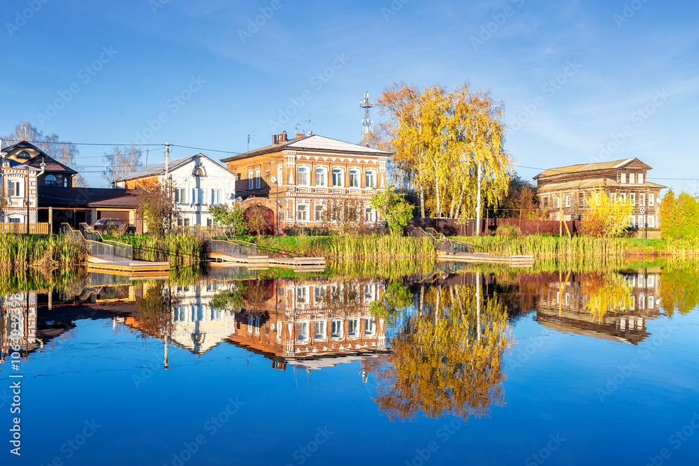 Fototapeta premium Bogorodsk, Nizhny Novgorod region, Russia, Street view of an ancient provincial Russian city on the shore of a lake on a summer evening. An ancient building of artisans, an architectural monument.