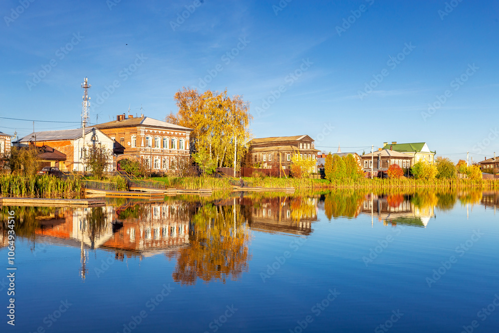 Fototapeta premium Bogorodsk, Nizhny Novgorod region, Russia, Street view of an ancient provincial Russian city on the shore of a lake on a summer evening. An ancient building of artisans, an architectural monument.