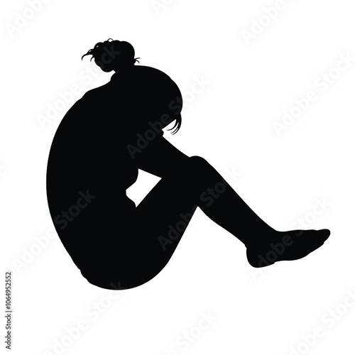 a black silhouette of a person sitting on the ground with their head in their hands.
