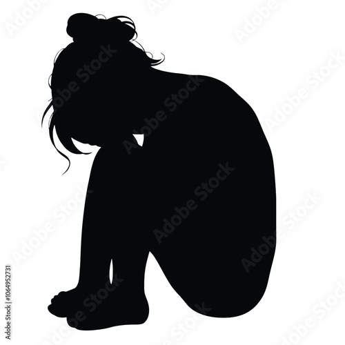 a black silhouette of a person sitting on the ground with their head in their hands.