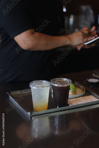 two cups of amaricano and ice soda on the table photo