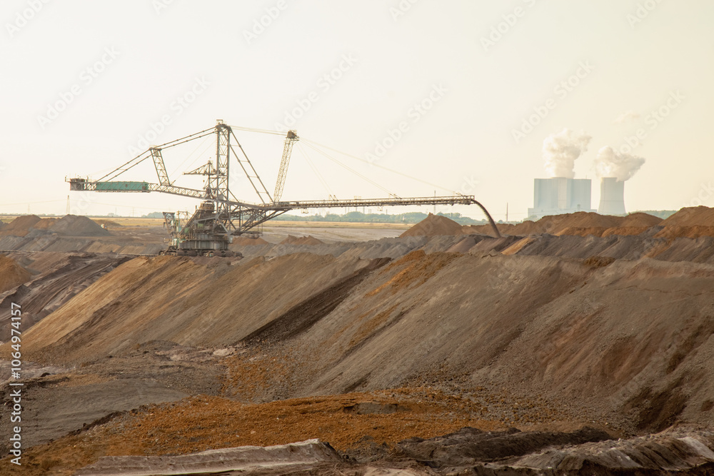 Vibrating screen stone crusher in operation. Quarry for processing minerals. Heavy and mobile equipment in a quarry for processing stone into building material. Horizontal image. Vibrating screen stone crusher in operation. Quarry for processing minerals. Heavy and mobile equipment in a quarry for processing stone into building material. Horizontal image.