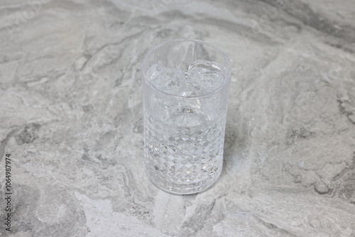 a woman droping americano to full of ice glass