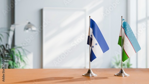 FLAGS OF HONDURAS And UZBEKISTAN ON TABLE