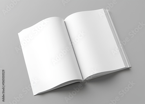 A blank magazine is open on a table showcasing its empty pages and binding in stark simplicity photo