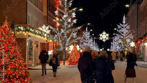 Snow on Festive Street Lights with Garlands, Winter Snowfall on Holiday Street Decorations
