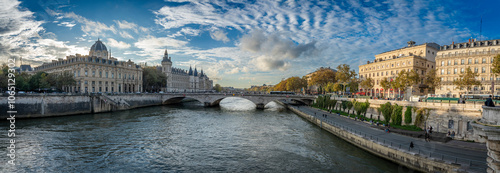 Paris, France - 10 28 2024: Panoramic view of Pont au Change and La Conciergerie on Ile de la Cité from quai de Seine.