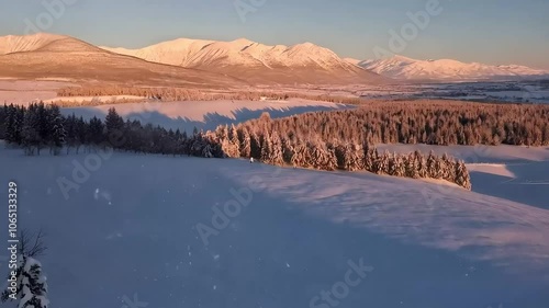 Light Snowfall Over Valley at Dawn, Dawn with Light Snowfall Over Snowy Valley
