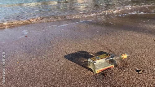 Bottle with a mysterious message on the beach of Budva. Video 4K