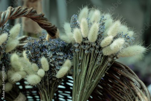 Bright dried flowers of lavender and lagorus ovatus in basket photo