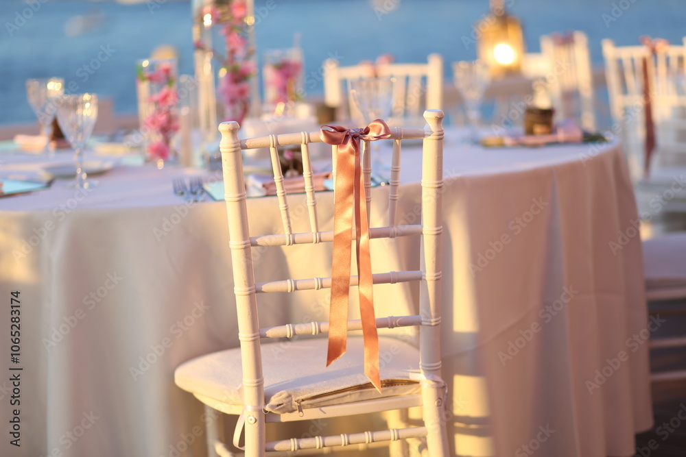 Romantic Sunset Table Setting by the Sea for a Special Event or Wedding