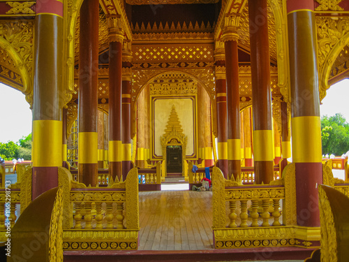 Tourist sitting and praying to Shwezigon pagoda an iconic ancient pagoda in Bagan kingdom of Myanmar. photo