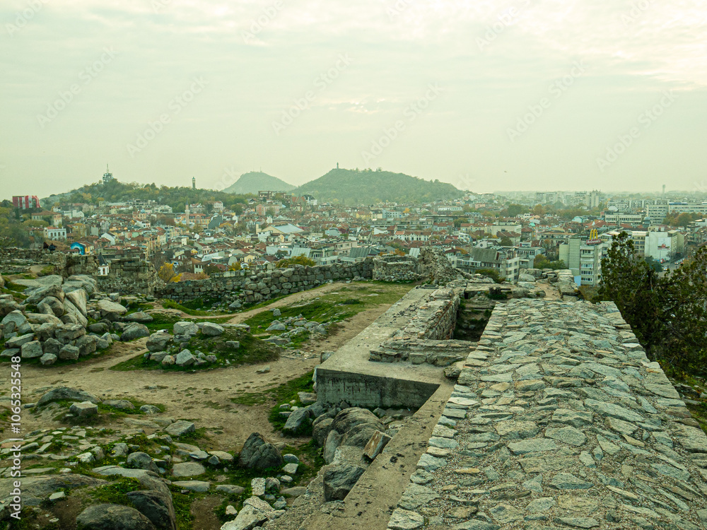 Obraz premium Ancient Roman theater of Philippopolis. It was built during the time of the Roman emperor Marcus Ulpius Trajan. Plovdiv, Bulgaria.Beautiful autumn view of the residential area of Plovdiv, Bulgaria,