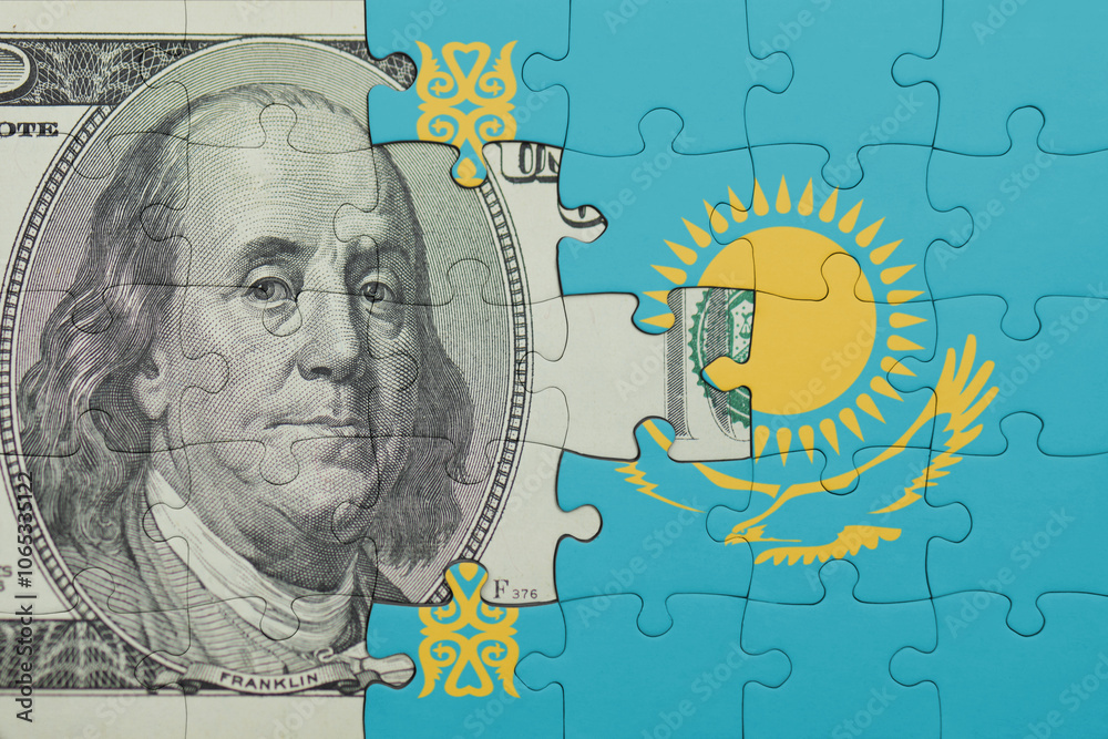 puzzle with the national flag of kazakhstan and the usa dollar money .finance concept puzzle with the national flag of kazakhstan and the usa dollar money .finance concept