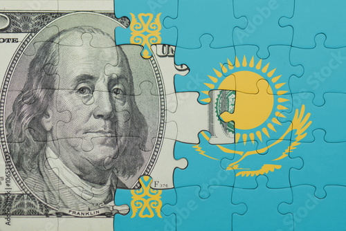 puzzle with the national flag of kazakhstan and the usa dollar money .finance concept