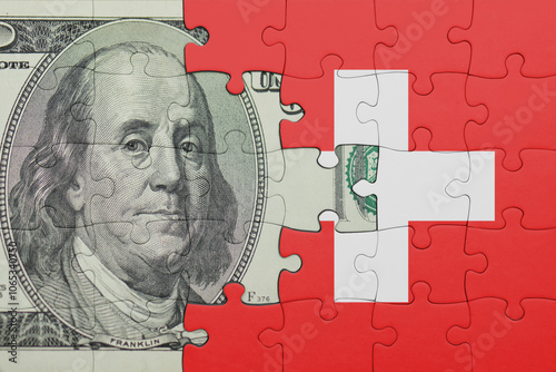 puzzle with the national flag of switzerland and the usa dollar money .finance concept photo