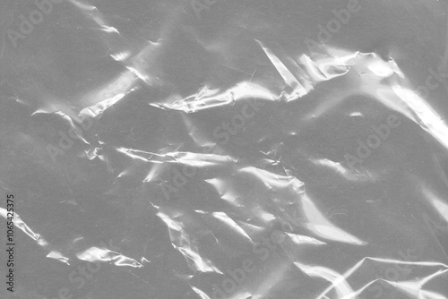 Plastic transparent black cellophane background. Natural plastic texture surface. 