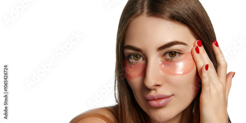 Close-up of young woman adjusting hydrogel under-eye patches against white background. Morning routine. Concept of beauty, healthcare, freshness and wellness, confidence. Ad photo