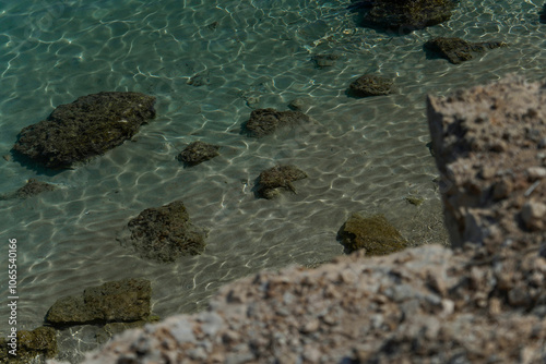 Turquoise Clear Sea Water with Fine Sand and Scenic Rocks Wallpaper