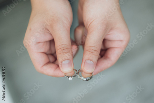 The bride and groom wear wedding rings.
