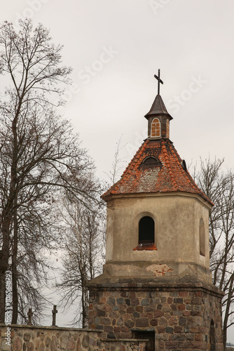 Bell Tower of a Church Rising Above a Parking Lot on a Beautiful Autumn Day photo