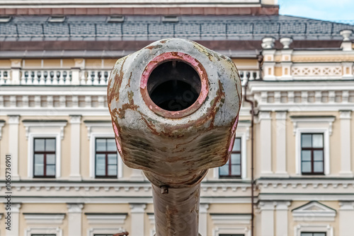 Close-up view of a tank's rusted barrel displayed at the Destroyed Russian Military Equipment Exhibition on Mykhailivska Square in Kyiv, Ukraine photo