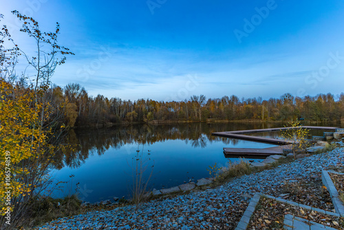 A walk in autumn by the reservoir among the leaves in Lisiniec Park photo