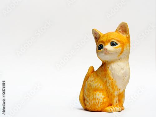 In tis photoillustration Vintage porcelain figurine of cat on white background