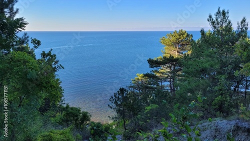 Sea, beach and pebbles, clouds in the sea. photo