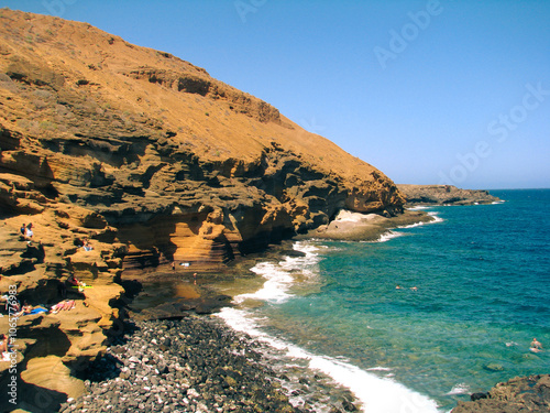 Beach Amarilla on Canary Island. Blue ocean and mountain photo