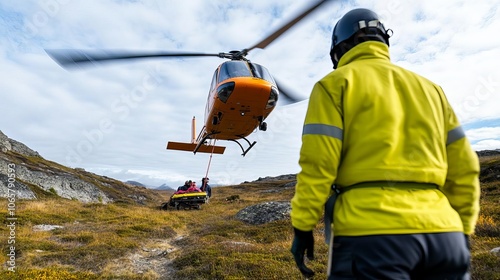 Helicopter rescue lowering stretcher to injured hiker, remote location, teamwork photo