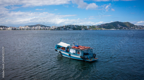 Beautiful aerial view of Guanabara Bay with a tourist boat sailing in the city of Niterói, Rio de Janeiro, Brazil